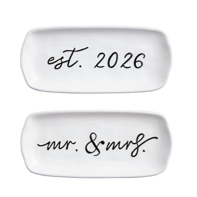 Two white ceramic plates with text 'est. 2026' and 'mr. & mrs.' on a white background.
