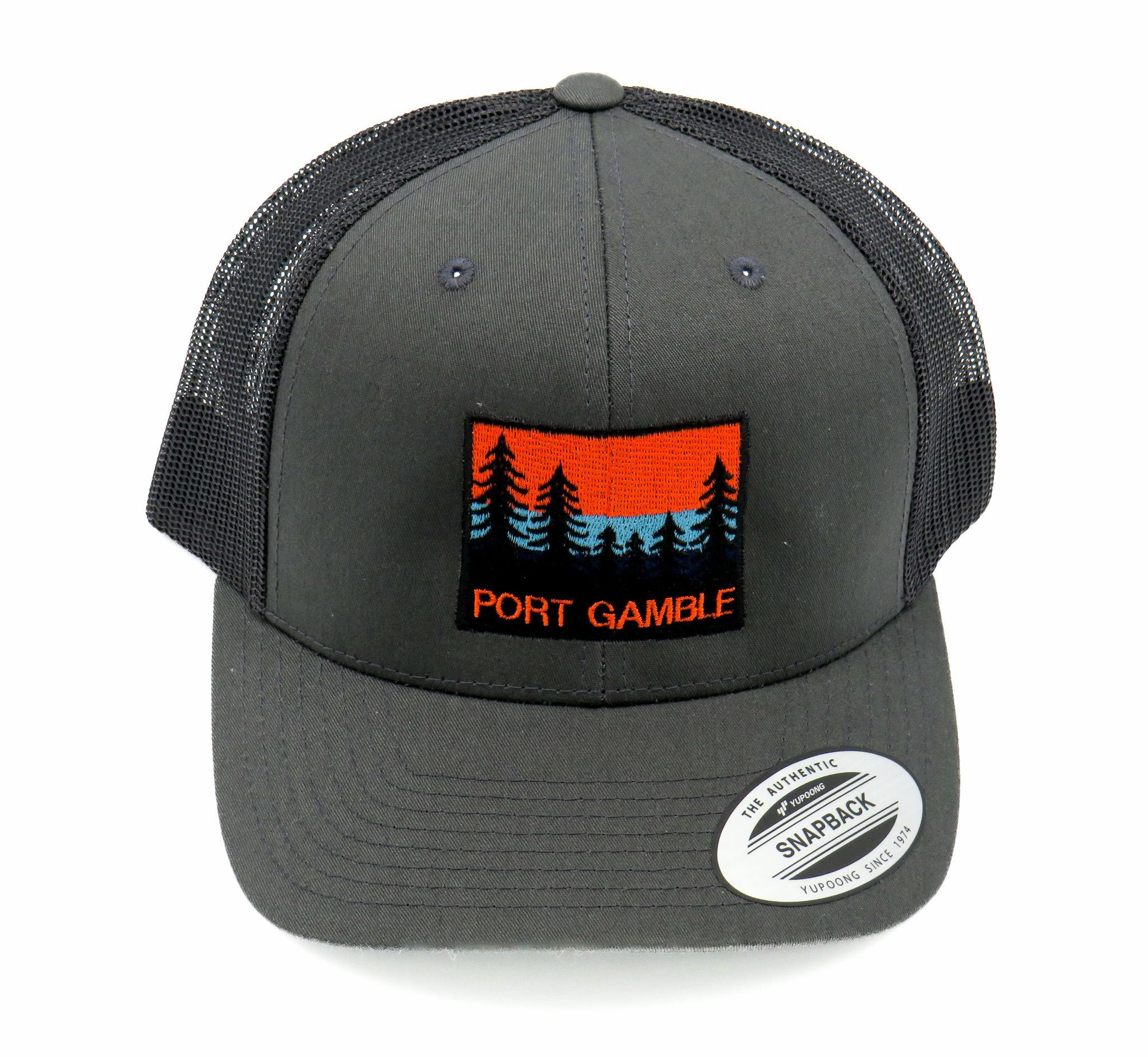 a Cap in charcoal color and colorful patch with trees and a beautiful sky backdrop, with "PORT GAMBLE" caption 