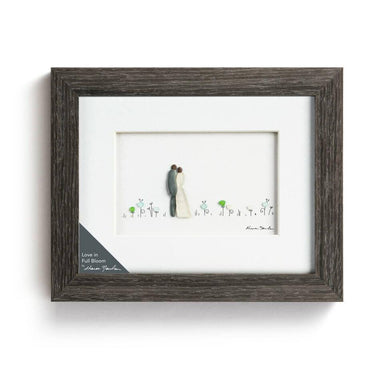 love frame art of a couple in a field , piece combines colorful sea glass and stones in a minimalist and modern design