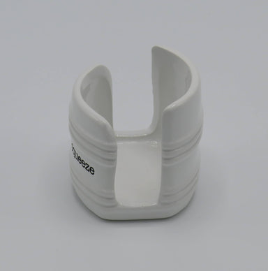 side view of white ceramic sponge holder with the legend "Give me a squeeze"