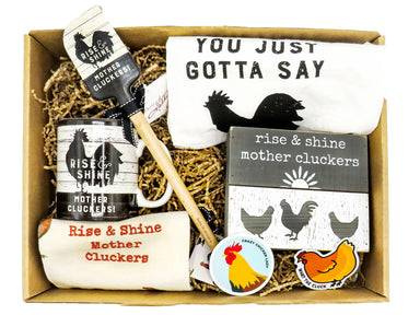 package includes a 'Rise and Shine Mother Clucker' sign, ceramic mug, quality towel, spatula, 2 stickers, and an embroidered dish towel.